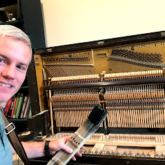 Image of Mezzo Piano Repair owner repairing and tuning upright piano.